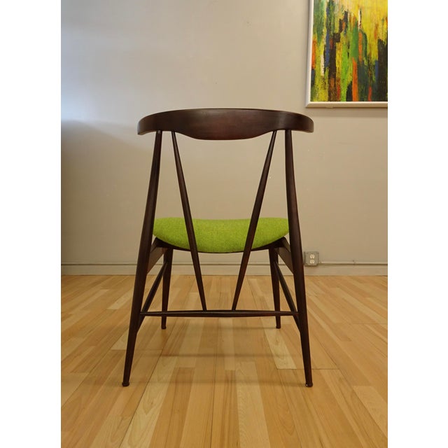 Single Mid century wooden chair believed to be American made. Interesting fine spindle construction with triangular seat...