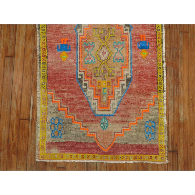 A fun Turkish Anatolian scatter size with a flashy array of electric colors. 2 Humans are also found on the center of the...