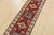 This traditional tribal geometric Caucasian Kazak runner is hand-knotted with an all-wool pile on a cotton foundation....