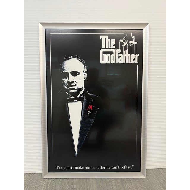 Design Plus Gallery presents a Framed Cinematic Movie Poster of The Godfather. This movie poster has Marlon Brando with...