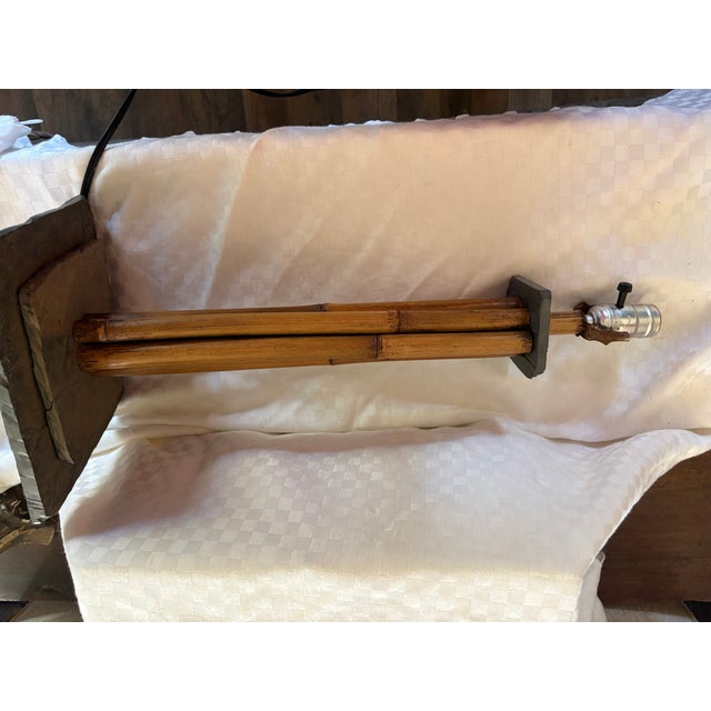 A mid century bamboo and slate pole table lamp. The lamp has a double slate base and a slate top. it will take a standard...
