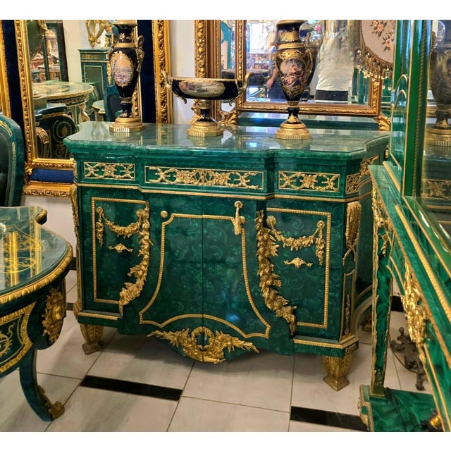 Make a grand statement with this Monumental Louis XVI Style Commode Cabinet, finished in a rich emerald bottle green tone...