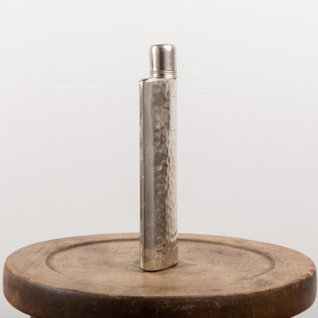 West German made hammered flask. This flask holds 12oz and is tin-lined.