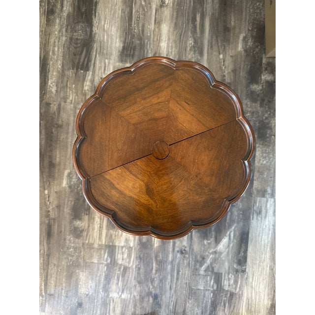 Three legged scalloped mahogany, accent table, ideal for drinks and or light snacks or a vase for decoration