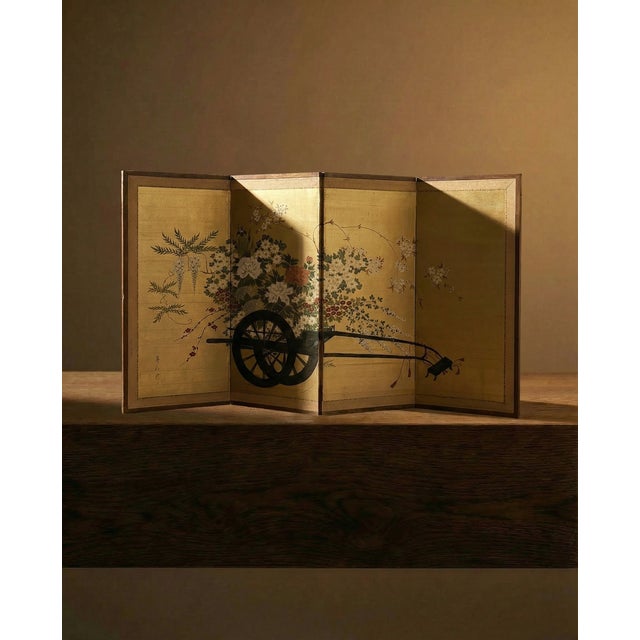 An exceptional Japanese four-panel folding screen (byobu) rendered in mineral pigments on silk with a luminous gold...