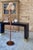 Harrison Van Horn "belly" console table in lacquered raffia and brass in deep, dark espresso brown with unlacquered brass...