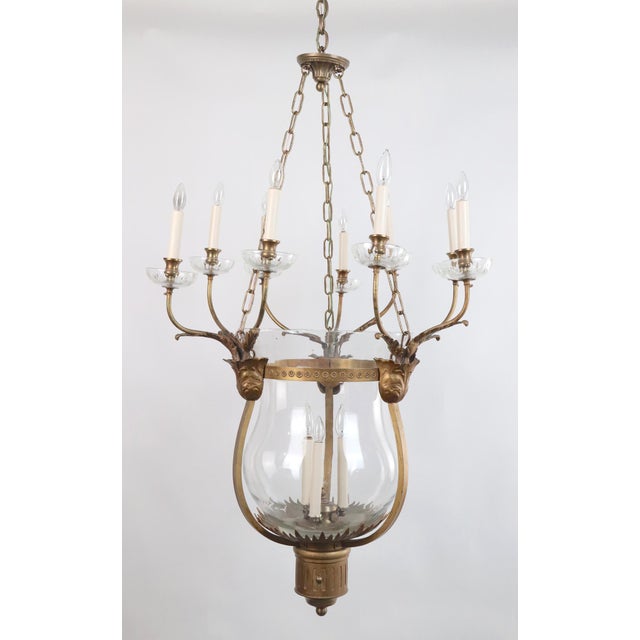 Antique hand blown glass bell jar chandelier with nine ornate bronze arms. Each arm has a candle style socket with glass...