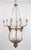 Antique hand blown glass bell jar chandelier with nine ornate bronze arms. Each arm has a candle style socket with glass...