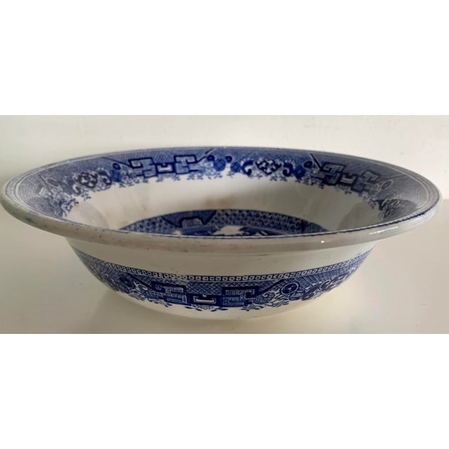 Antique English Staffordshire blue and white transfer-ware serving bowl in the traditional Blue Willow pattern. 9.5” D x...