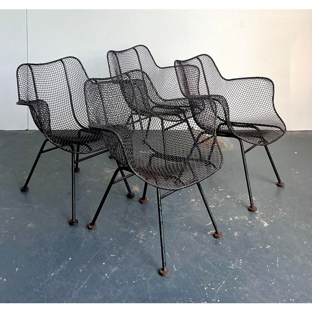 These iconic "Sculptura" armchairs, designed by Russell Woodard in the 1950s, represent a pinnacle of Mid-Century Modern...