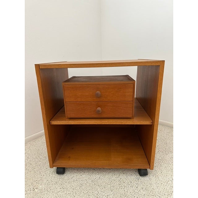 Classic Danish Mid-Century Modern teak desk cabinets. * The first piece includes two (2) drawers and a third file drawer,...