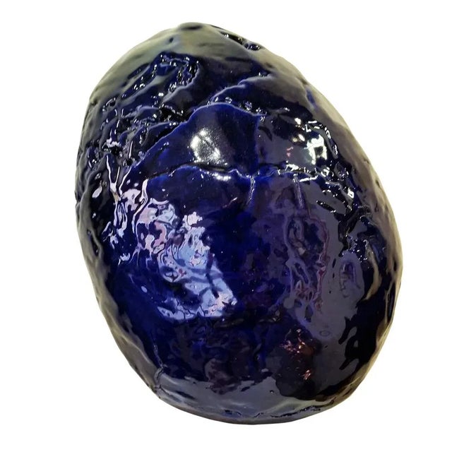 Thon, "Man's egg", terracotta sculpture with overlapping reliefs, deep blue color, h cm.30x24, signed and dated 2000,...