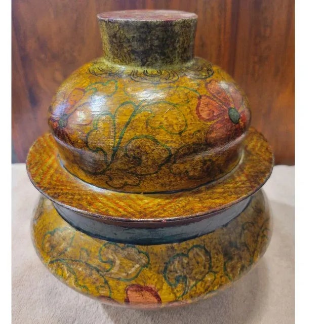 A beautifully painted bowl with a lid that was once used for storing the famous Tibetan barley flour (Tsampa). These bowls...