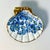 We love this pretty trinket catchall seashell dish. It’s a Folk Art craft piece. The artist has added a floral designed...