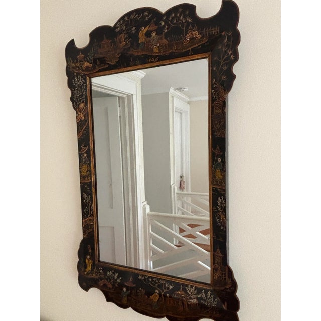 Exceptional and unusual 19th century chinoiserie mirror with beveled and scalloped border. Covered in scenes of women in a...