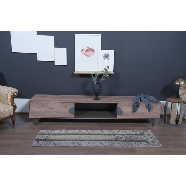Bring classic, earthy minimalism to your space with this authentic 1970s handwoven Anatolian runner rug. Featuring a...