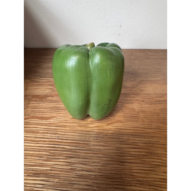 A wonderfully realistic ceramic green bell pepper by noted Alabama artist Mary Kirk Kelly (1918–2013), signed and dated...