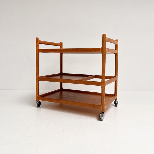 Unique solid teak trolley by Johannes Andersen for Silkeborg. Danish design from the 1960s. The trolley has an organic...