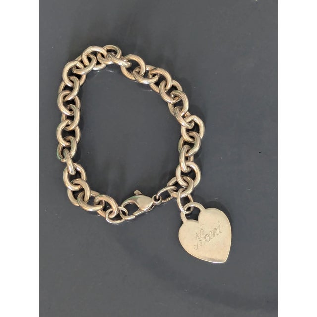 Tiffany & Company charm bracelet from late 80's. Comes with it's original Dustbag. The engraving is of superb quality from...