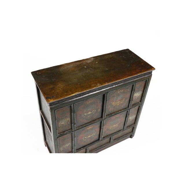 Mid to late 20th century, rectangular top, linear design frieze, the front of the cabinet with polychrome decorated panels...