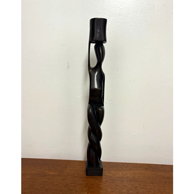 Tall vintage hand-carved wood candlestick featuring an elongated abstract figure and twisted carved design. Dark Brown...