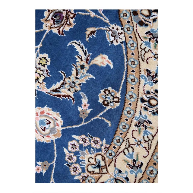 Persian Nain rugs are renowned for their detail and fine use of outlining along the central motifs. Breaking from the...