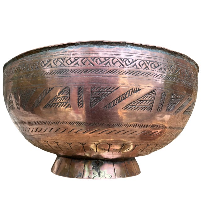 A set of 3 old copper decorative bowls hand wrought in India. The base of the large bowl is copper over brass and is...