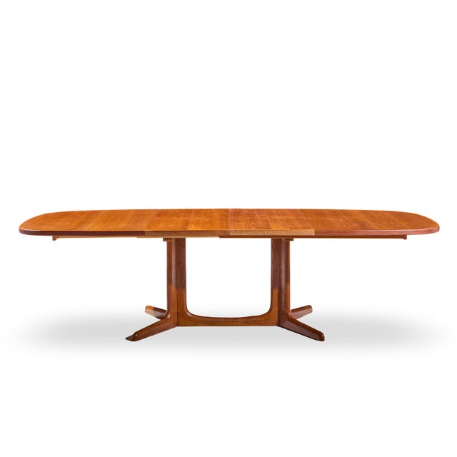 Gudme Møbelfabrik Mid Century Danish Teak Expanding Dining Table with 2 Leaves This table measures: 63.75 wide x 41.5 deep...