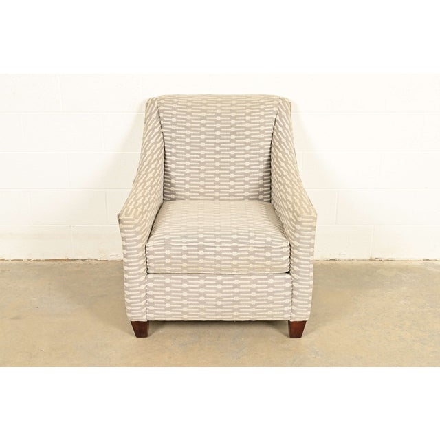 A nice contemporary gray upholstered club chair or lounge chair In the style of Baker Furniture By Bassett Furniture USA,...
