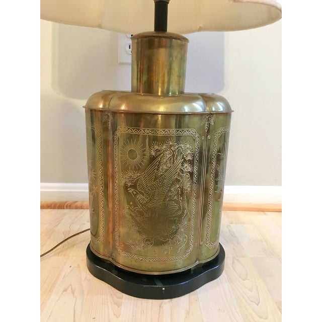 Large Hollywood regency / Chinoiserie Asian style brass urn lamp with etched drawings on all four sides. Comes with...