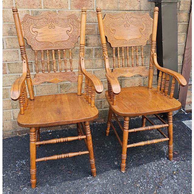 A Pair Mid-Century Century Red Oak Pressback Armchairs. Great vintage condition Measures 24" in width, 22" in depth and...