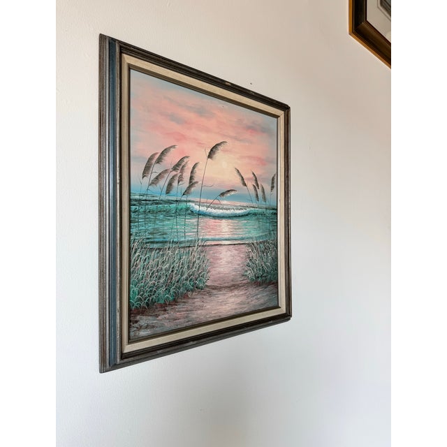 This vintage oil painting on canvas captures the serene beauty of a seascape at sunset in an impressionist style. The...