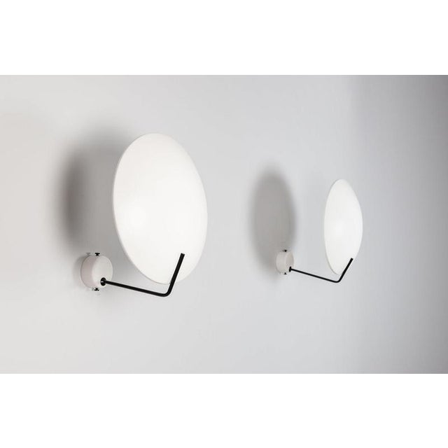 Pair of model 232 wall sconces designed by Bruno Gatta for Stilnovo, Italy, 1954. A striking pair of Italian mid-century...