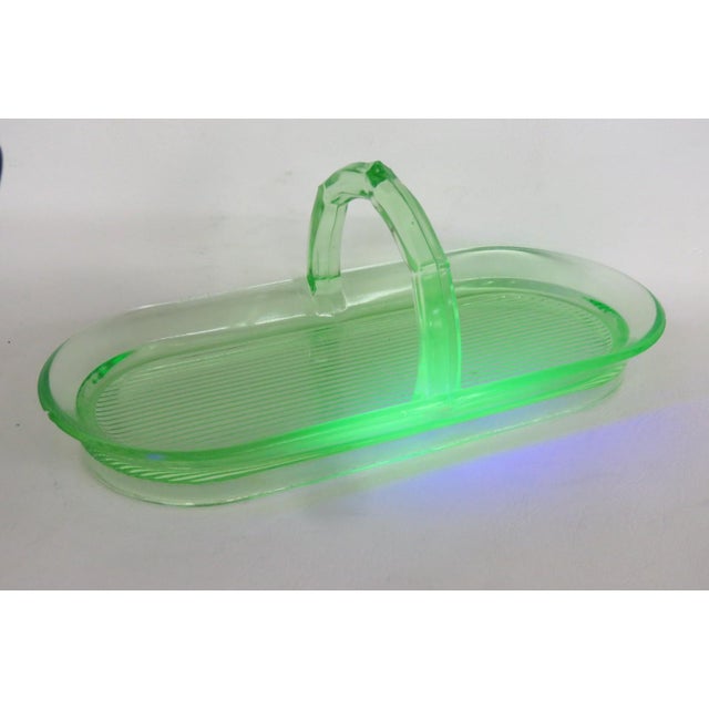 This beautiful Celery Tray / Serving Plate is made out of vaseline/uranium glass. This gorgeous basket style dish was made...