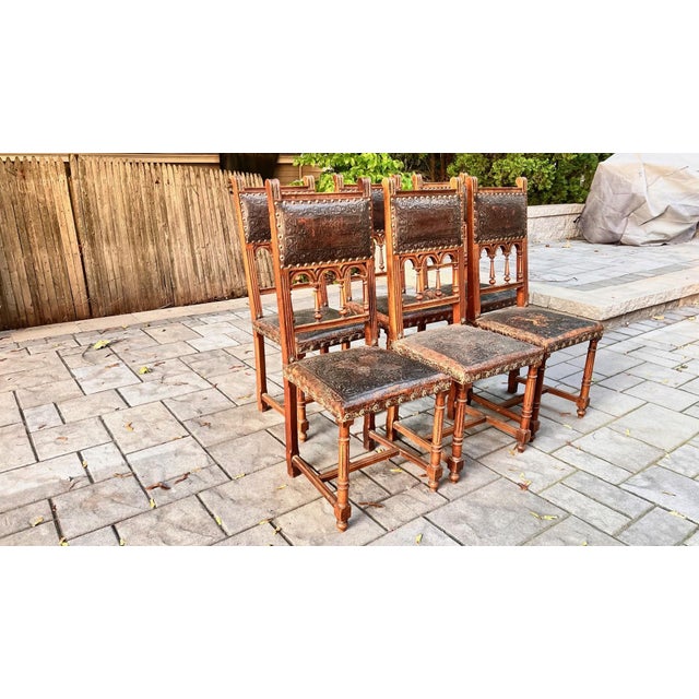 Own a remarkable piece of history with this exquisite set of six antique dining chairs from 19th-century France. Crafted...