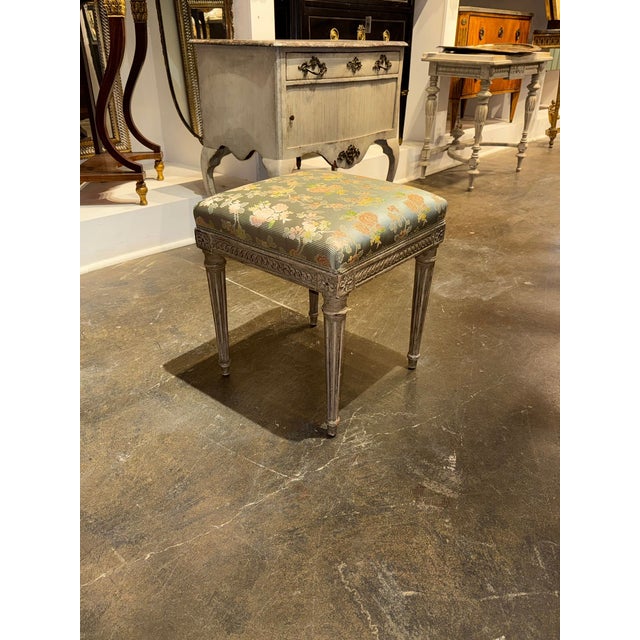 The product is a 19th century French Louis XVI stool, making it an antique piece with historical and cultural value. This...