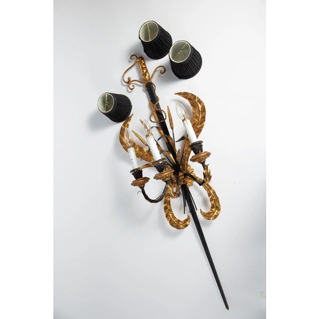 This Italian style sconce has three fabric shades, a sword motif, and gilded wheat stalks. A real statement maker! It...