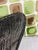 This is a Pair of modern cut velvet poca dot pillows. With tones of apple green and cocoa brown and a cream background....