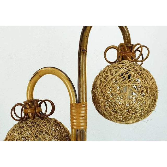 Rare floor lamp from the 1950s, probably from Italy or France. Made of bamboo and rattan, shades made of woven cord. For 3...