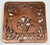 Vintage copper and cast iron tea kettle motif trivet. Hanging hardware on the back and rubber pads to the feet. Marked...