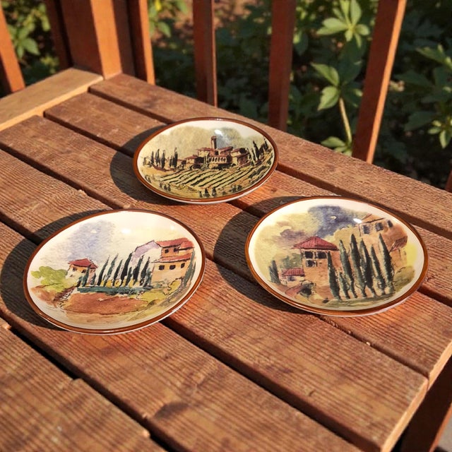 The product is a set of three Tuscan scene painted dipping bowls from Williams-Sonoma. These ceramic bowls feature a...