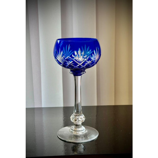 A set of five french saint-louis massenet crystal hock wine glasses with cobalt-blue cut-to-clear bowls, estimated to date...
