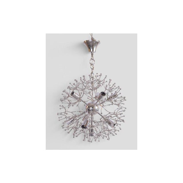 With cosmic elegance and a sculptural form, the Sputnik chandelier designed by Gaetano Sciolari in the 1970s is a...