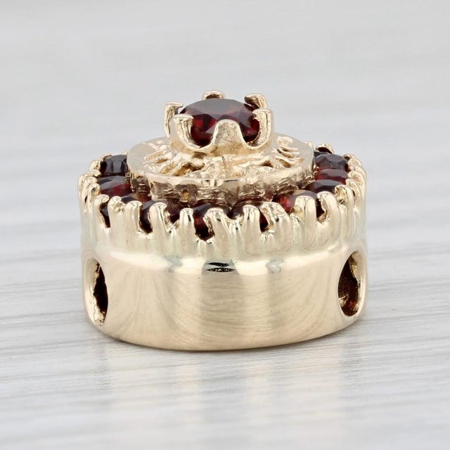 Gemstone Information: - Natural Garnets - Total Carats - 1.60ctw Cut - Oval 0.55ct, Round Brilliant 1.05ctw Color - Dark...