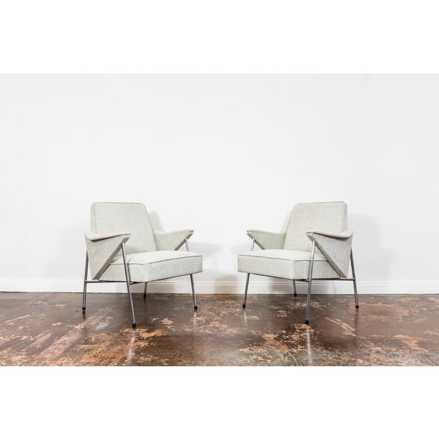 A pair of armchairs manufactured by Fabryka Mebli Wschód in Zadziele, Poland, in the 1960s. The armchairs have been...