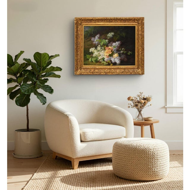 This antique floral still life painting is a refined 19th-century oil on canvas, of French origin. The composition depicts...