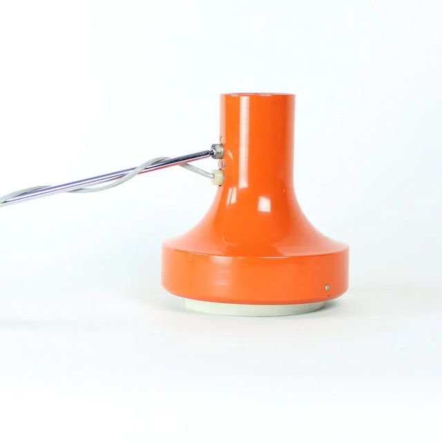 Original mid-century wall lamp produced by Napako company in 1960s. Designer Josef Hurka. The lamp is made of orange metal...