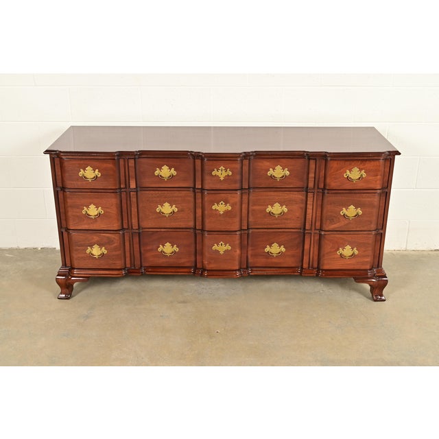A gorgeous Georgian or Chippendale style nine-drawer block front triple dresser or credenza By Kindel Furniture,...