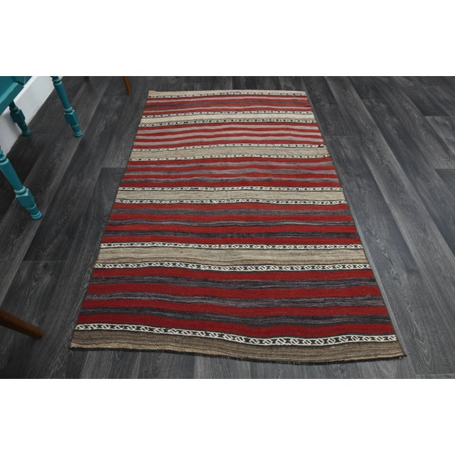 Vintage Turkish Hand-Knotted vintage rug is a semi-antique vintage area rug.'70s Eastern region of Turkey's unique rug is...