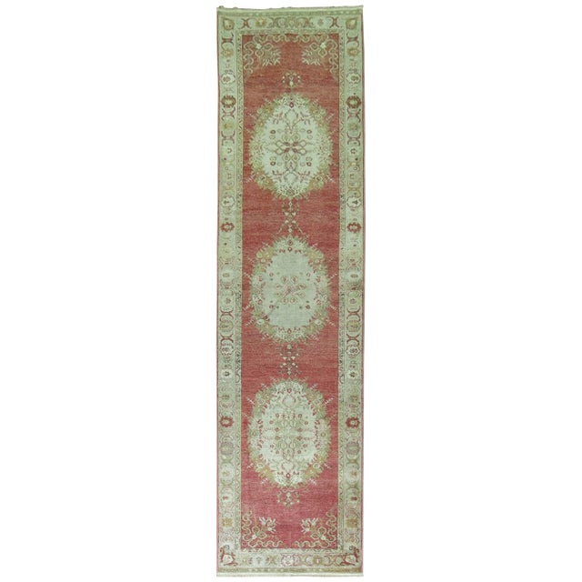 Classic vintage Oushak runner with three medallions occupied by an elaborate border.